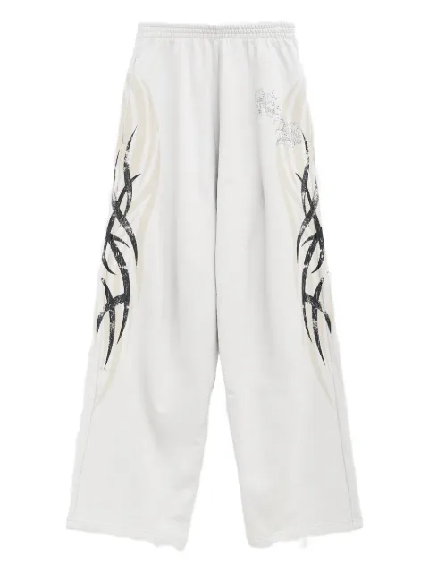 Balenciaga pantalones anchos con estampado gráfico