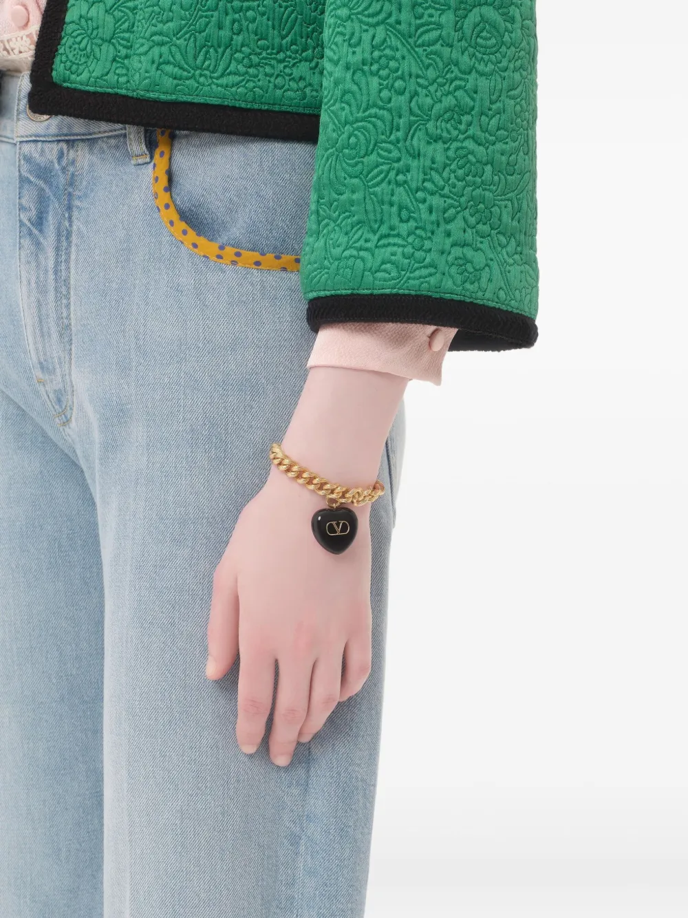Valentino Garavani Goudkleurige schakelarmband met hart bedel