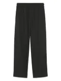 AMI Paris elasticated patch-pocket trousers - Black