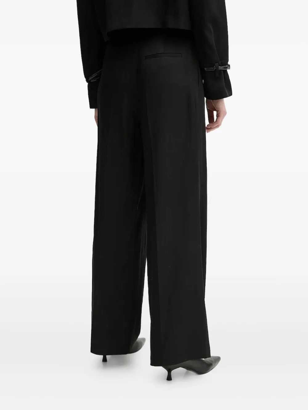 Isabelle Blanche Pleated Buckle-detail Trousers In Black
