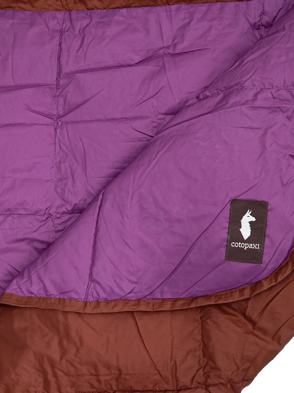 COTOPAXI Tweekleurige gewatteerde poncho Paars