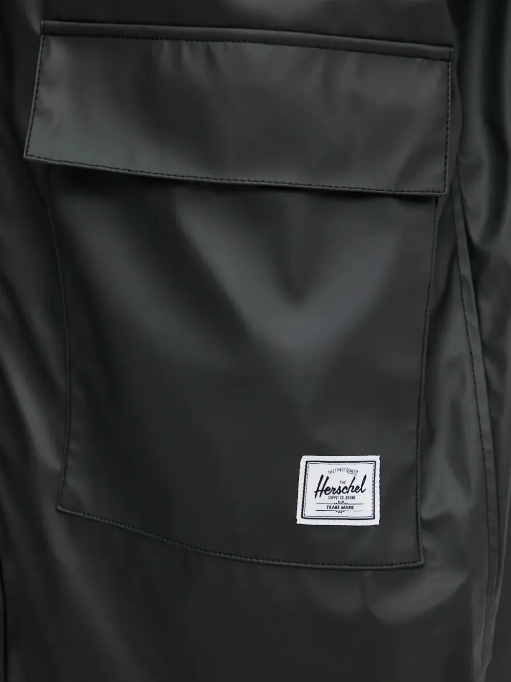 Herschel Supply Co. Regenjas met capuchon en klepzak Zwart
