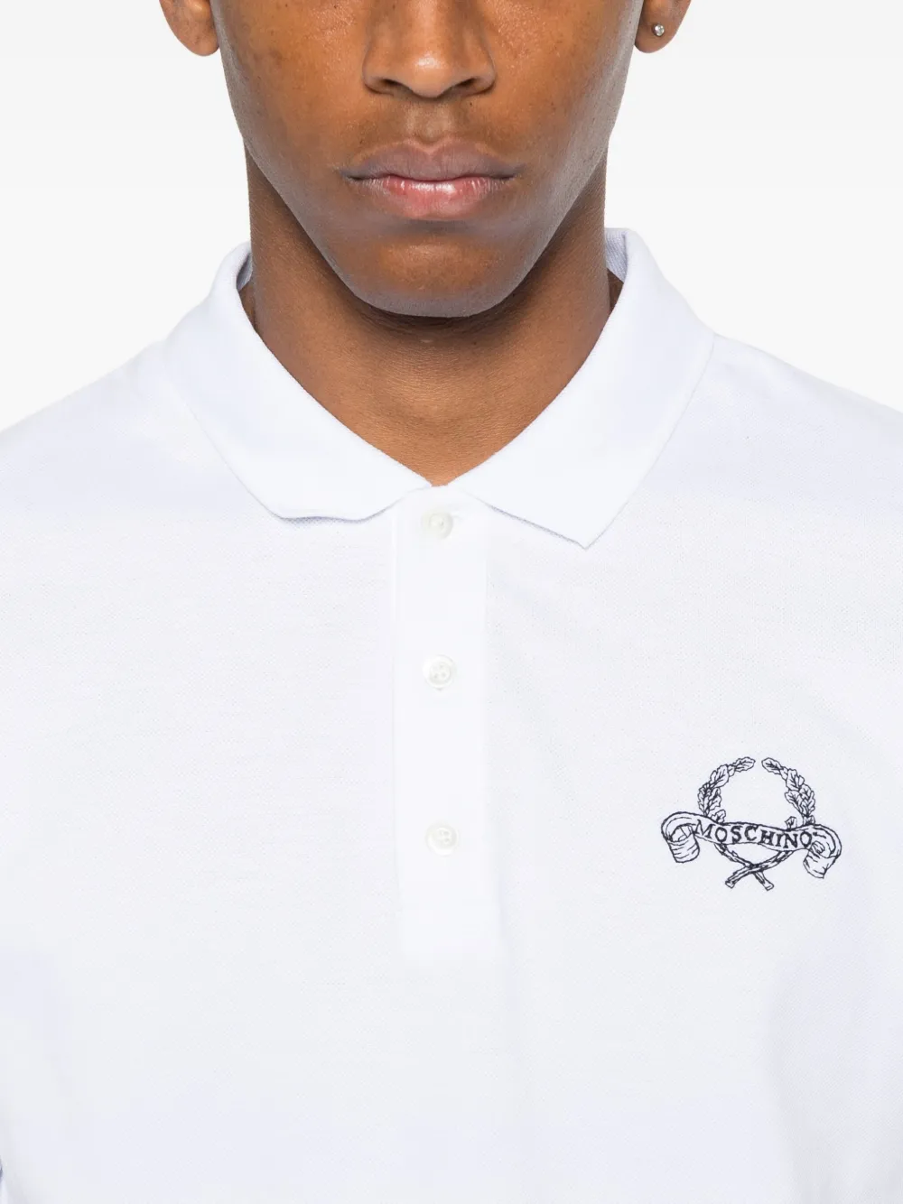 Moschino logo-embroidered polo shirt Wit