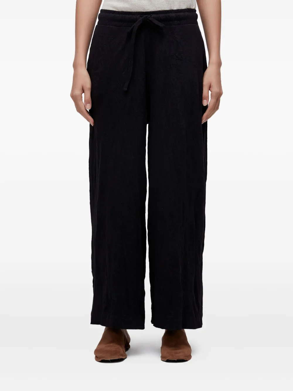 Osklen wrinkle-effect trousers | Black | Image 1