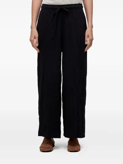 Osklen wrinkle-effect trousers 