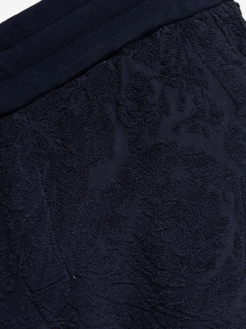 Versace textured-cuff trousers Blauw