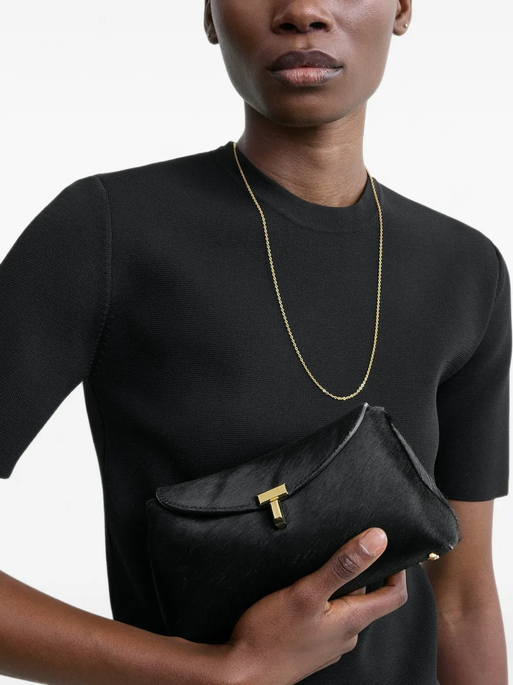 TOTEME T-lock clutch met ponyhaar Zwart