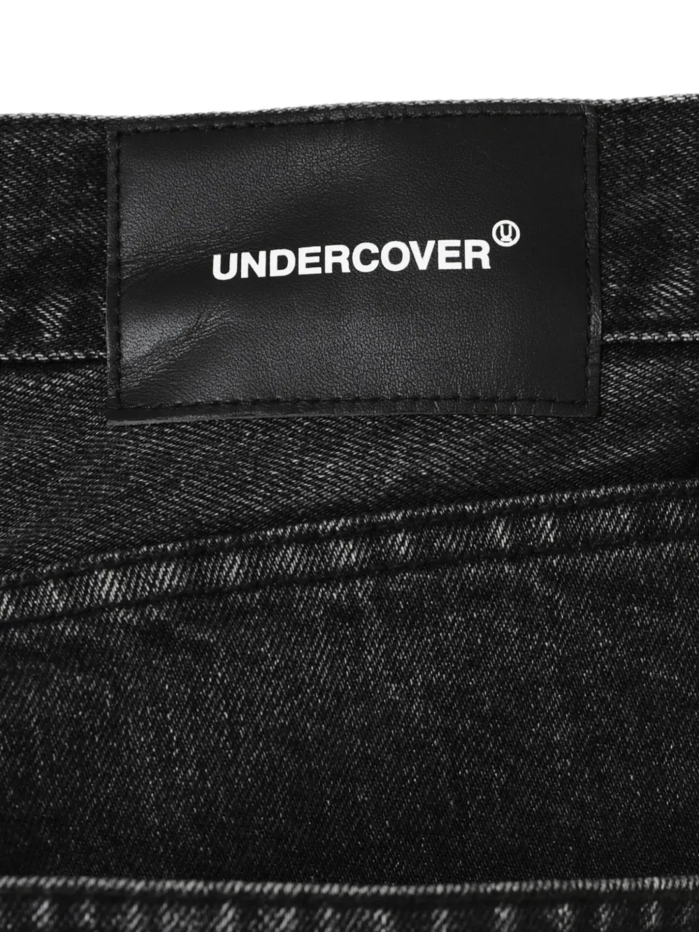 Undercover spider-embellished jeans Zwart