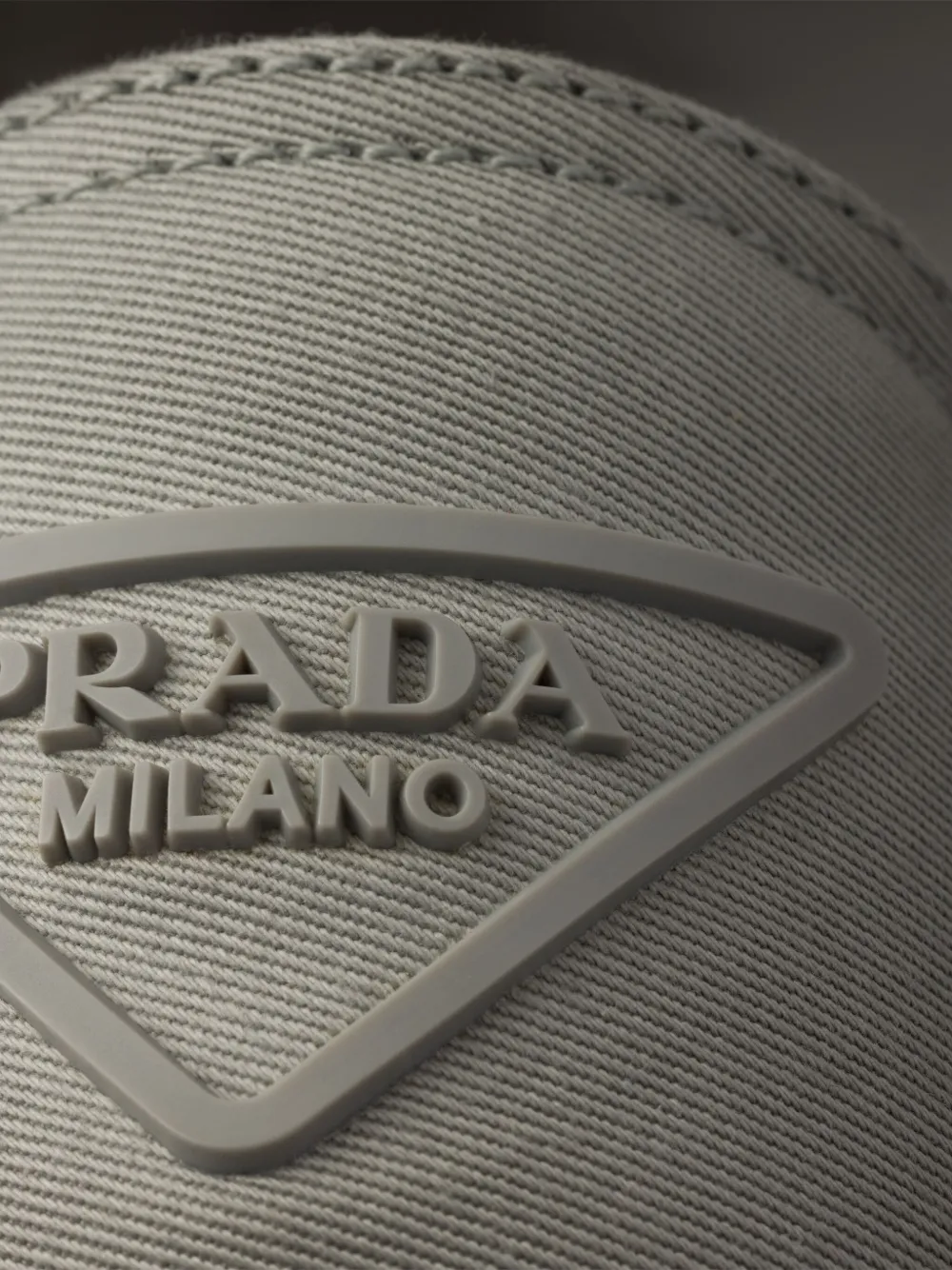 Prada embossed-logo slip-on Grey