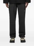 Oakley logo-patch nylon trousers - Black