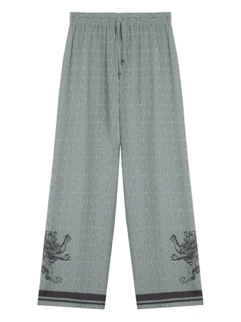 DDA lion-embellished geometric-print pants