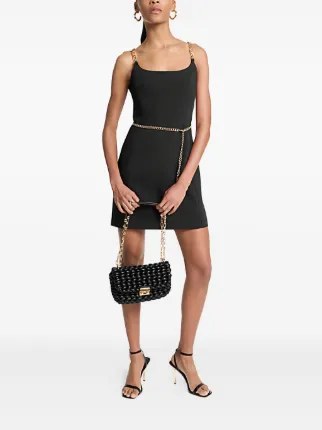 michael kors black dress This stunning dress features dramatic pleated shoulder details that add architectural interest and make a bold statement Michael Michael Kors Black Dress