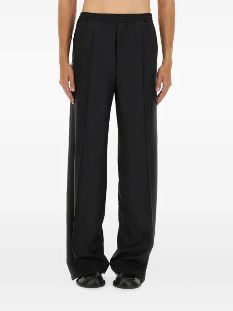 Moschino button-embellishment trousers