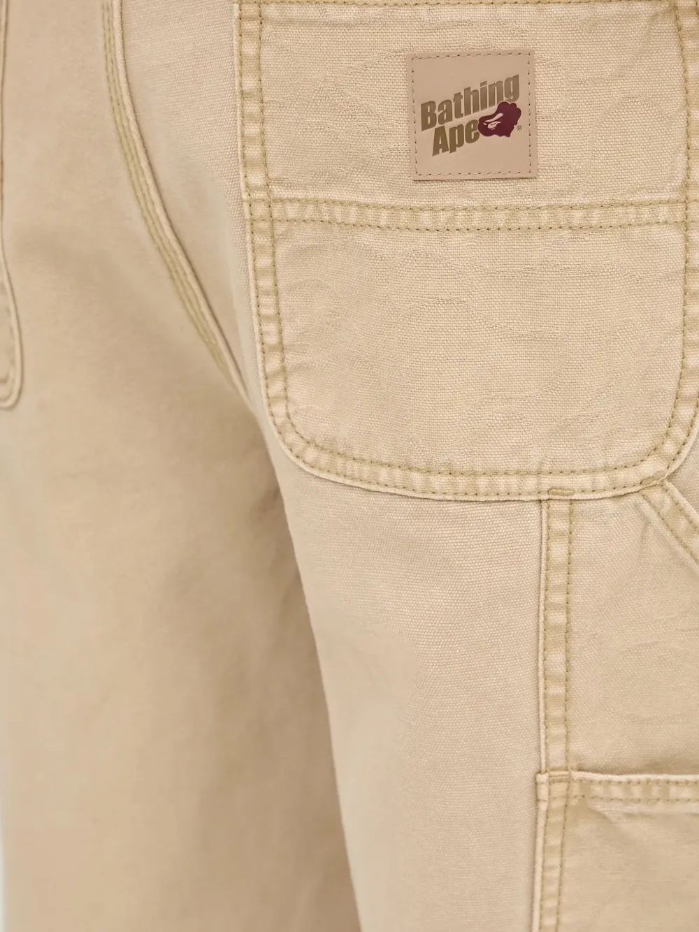 A BATHING APE logo-patch trousers Beige