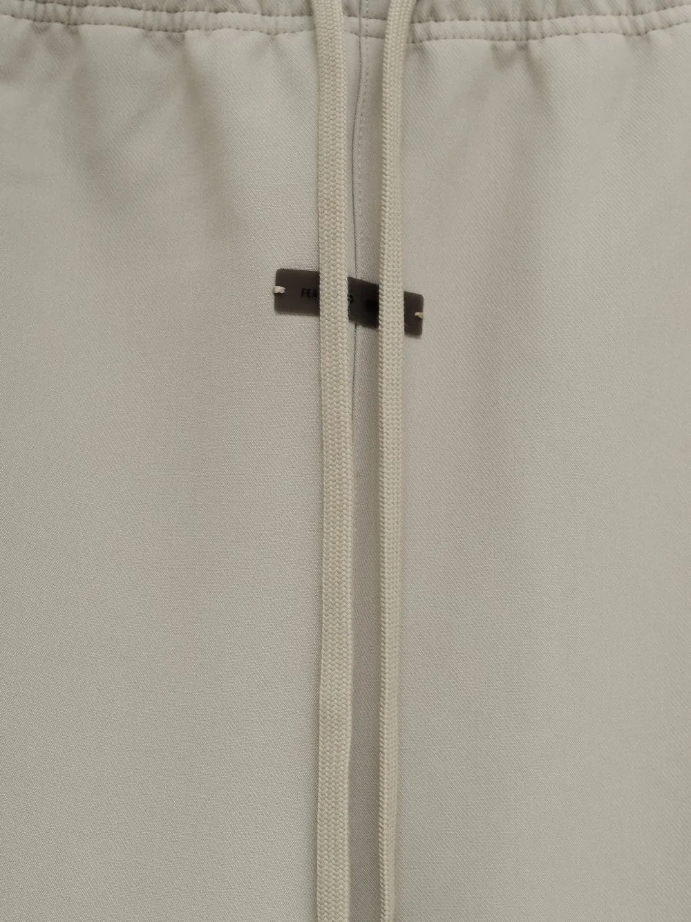 FEAR OF GOD ESSENTIALS drawstring side-split trousers Beige