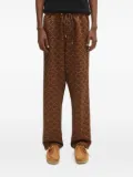 A BATHING APE® logo-print side-stripe trousers - Brown