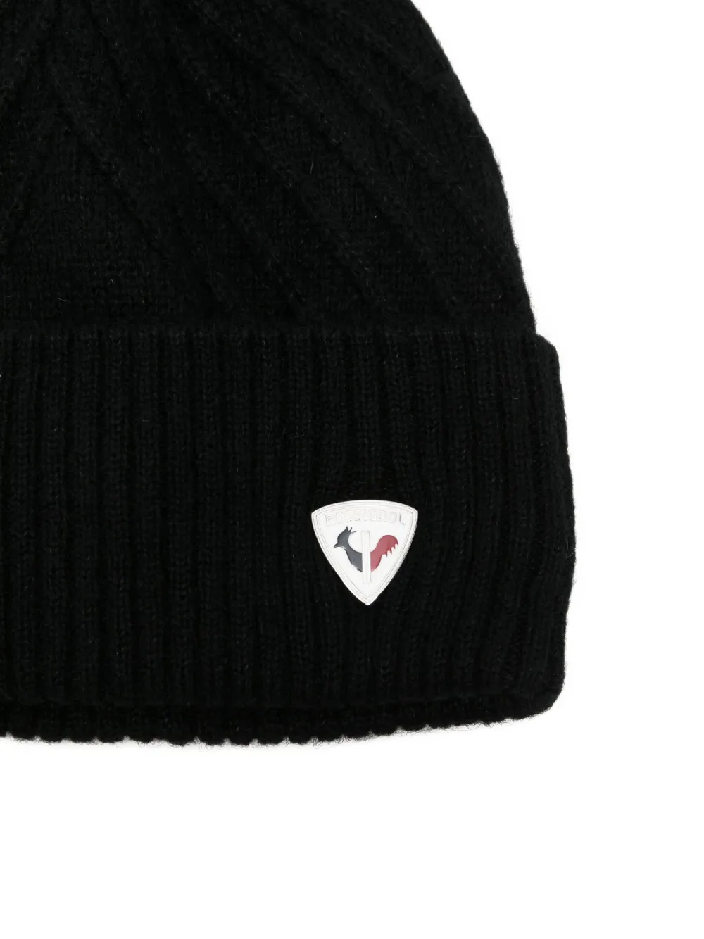 Rossignol Sara kabelgebreide muts met pompon Zwart
