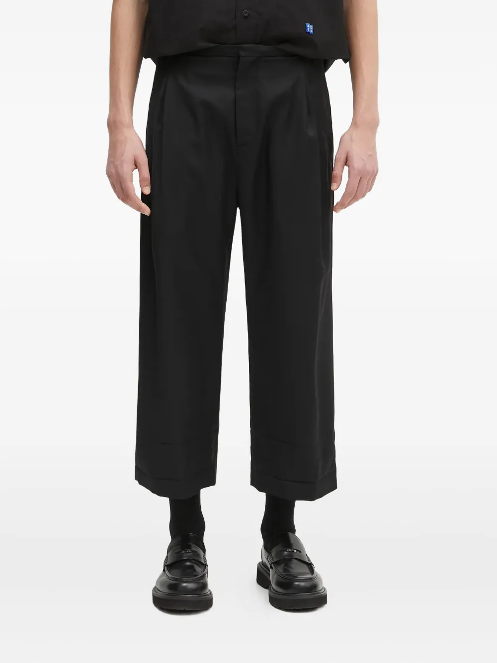 Ader Error Pleat-detailed Cuffed Trousers In Black