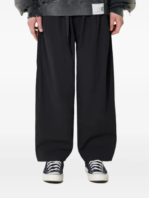 MANASTASH pantalones con bolsillos con cierre