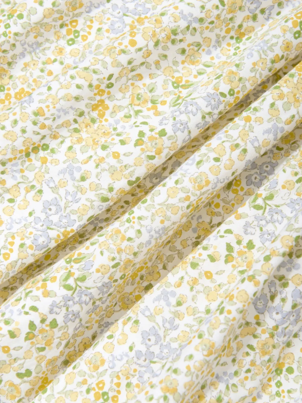 Sarah Louise Jurk met bloemenprint en gesmockt vlak Geel
