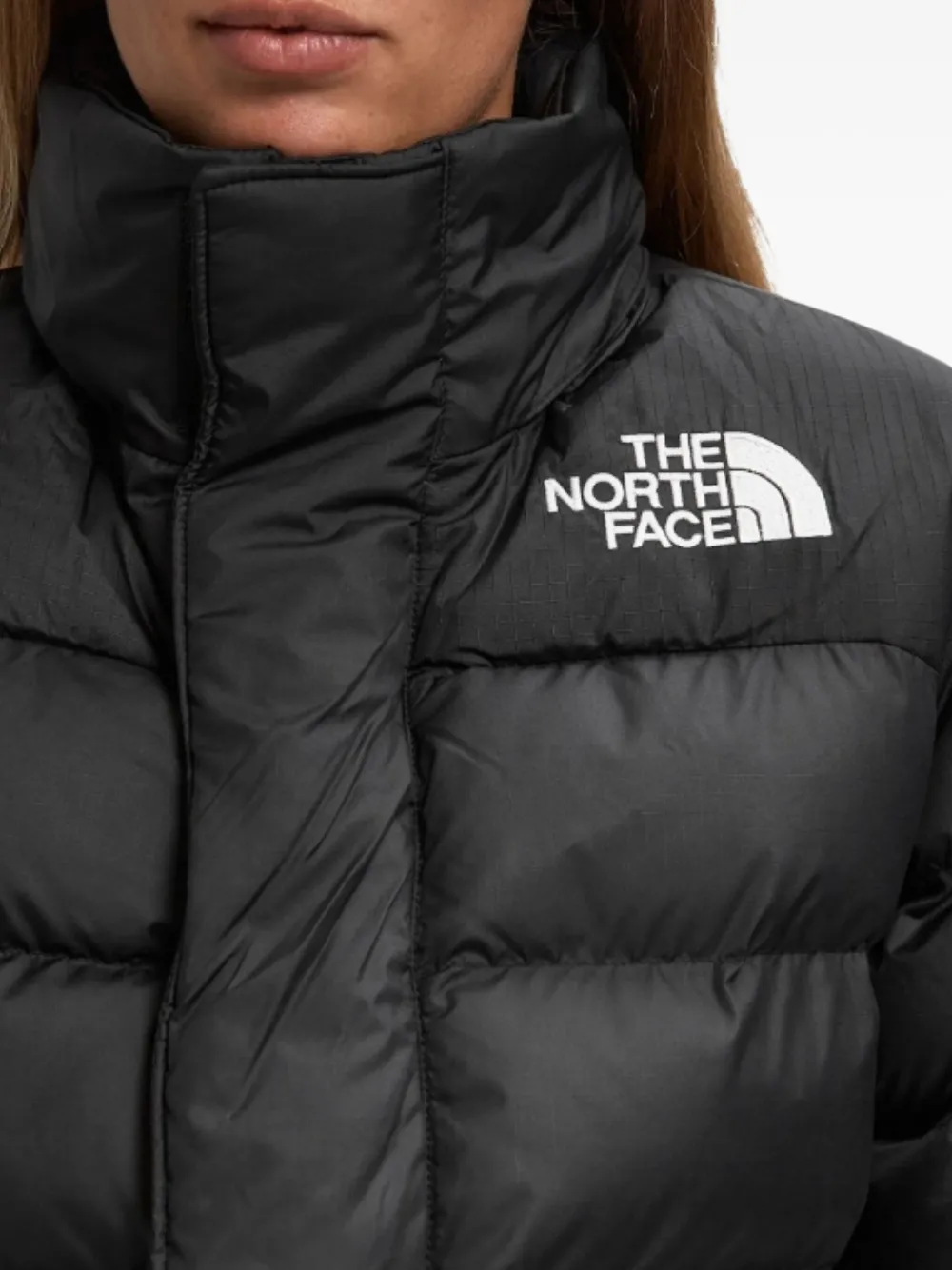 The North Face Limbara donsjack met zak Zwart