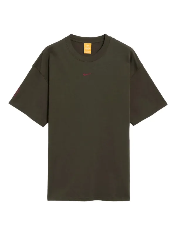 green and grey nike shirt