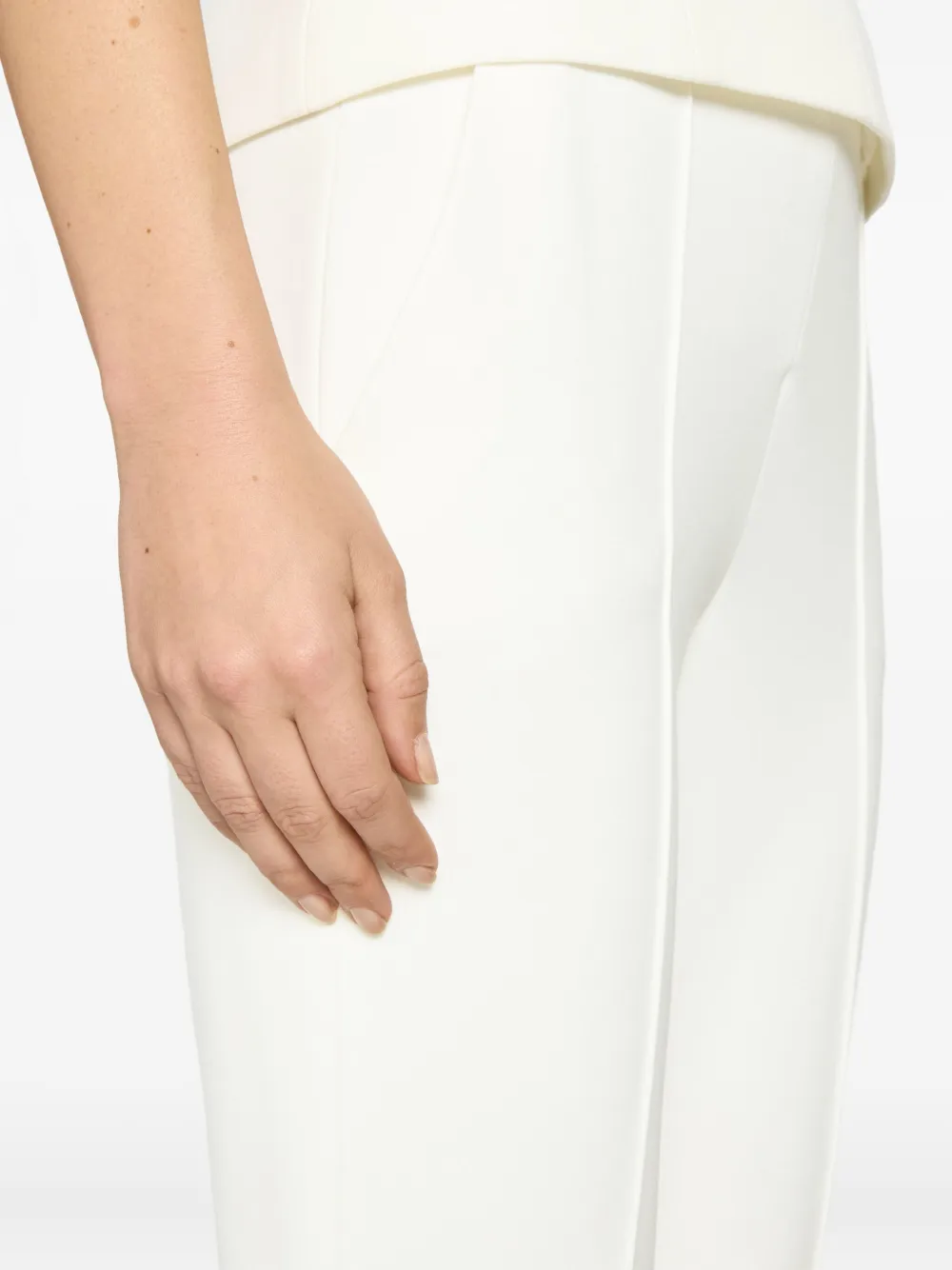 Genny Flared-hem Trousers In White