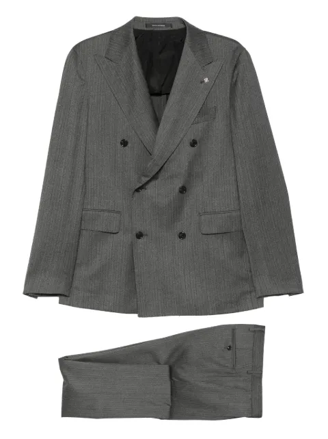 Tagliatore traje con doble botonadura