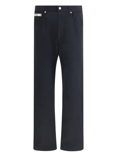 Moschino logo-plaque trousers