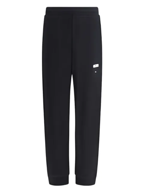 Moschino logo-print cuffed trousers