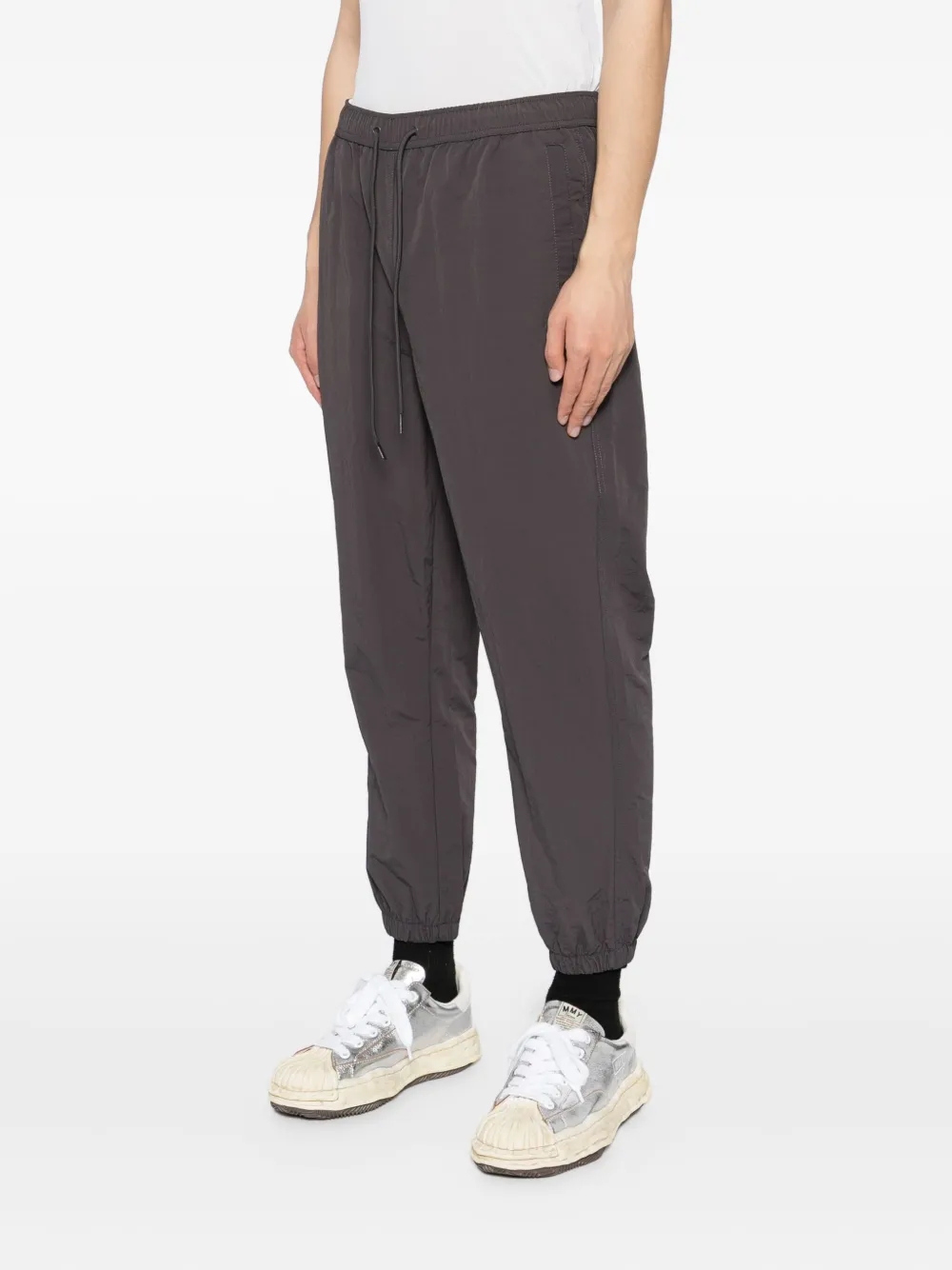 Fingercroxx Logo-patch Trousers In Black