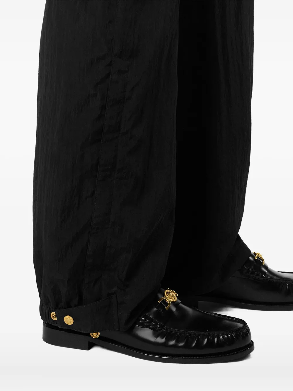 Versace Elasticated-cuff Trousers In Black
