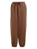 adidas Essentials printed-logo track pants - Brown