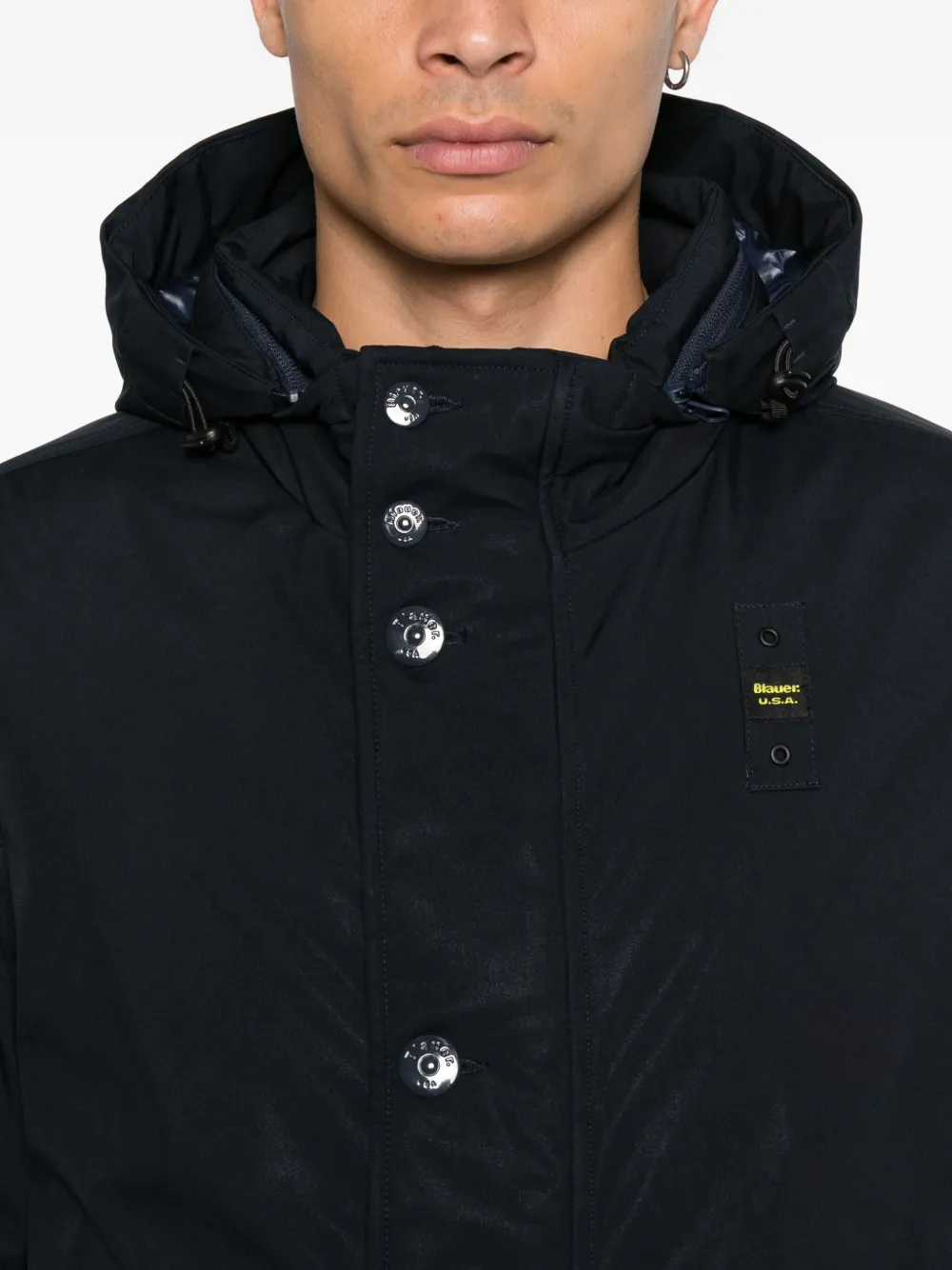 Blauer Jack met capuchon en knoopsluiting Blauw