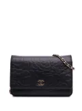 CHANEL Pre-Owned 2012 Lambskin Camellia Embossed Wallet On Chain crossbody bag - Black