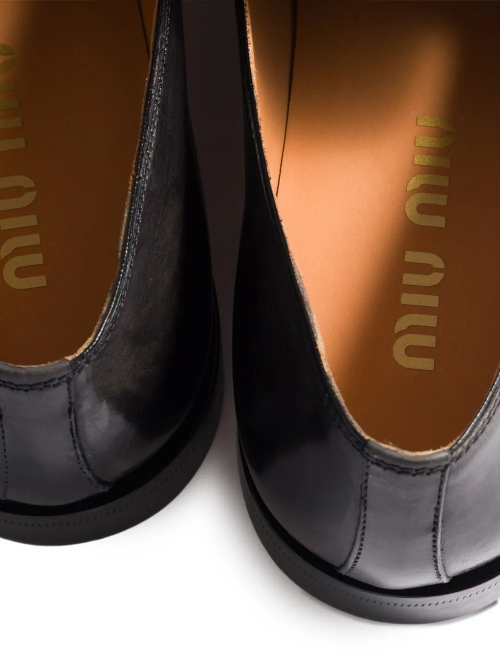 Miu Miu Embossed-logo Leather Loafers In Black