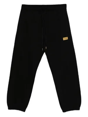 A BATHING APE® シャークヘッド トラックパンツ | ブラック | FARFETCH JP