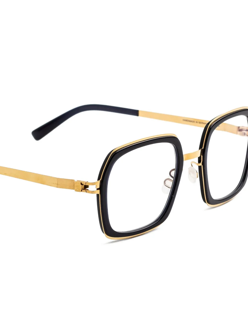 Mykita Bril met geometrisch montuur met goudkleurige details