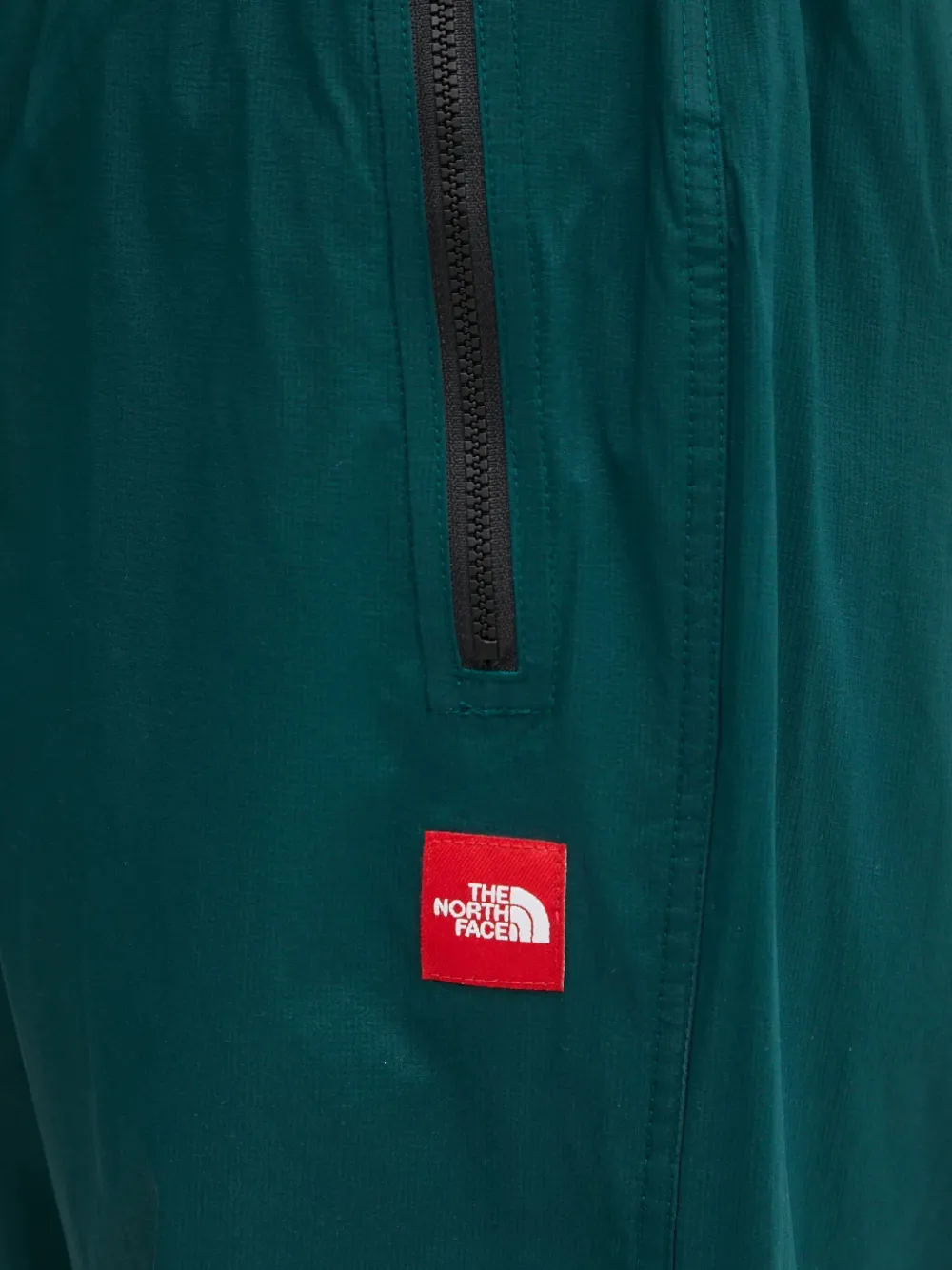 The North Face Elastische broek met ritszak Groen