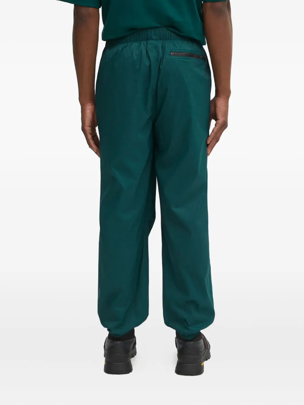 The North Face Elastische broek met ritszak Groen