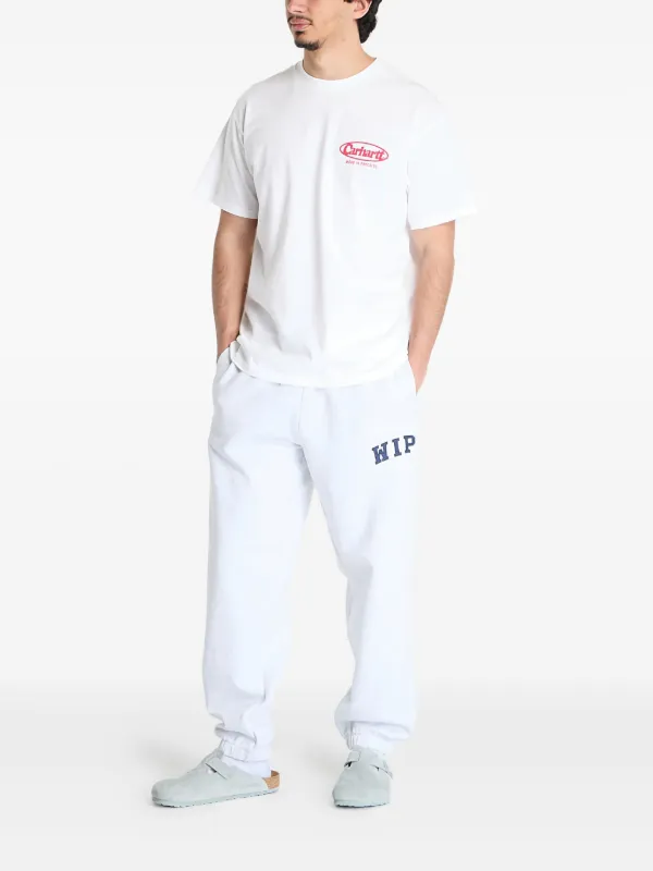 Carhartt WIP logo-patch Track Pants | White | FARFETCH