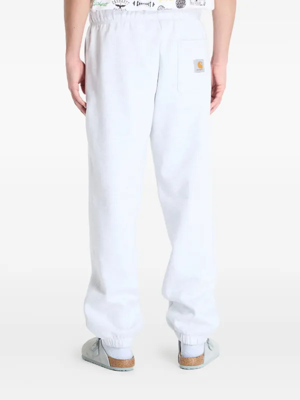 Carhartt WIP logo-patch Track Pants | White | FARFETCH