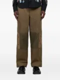 Baziszt Asher floral-embroidered patched trousers - Green