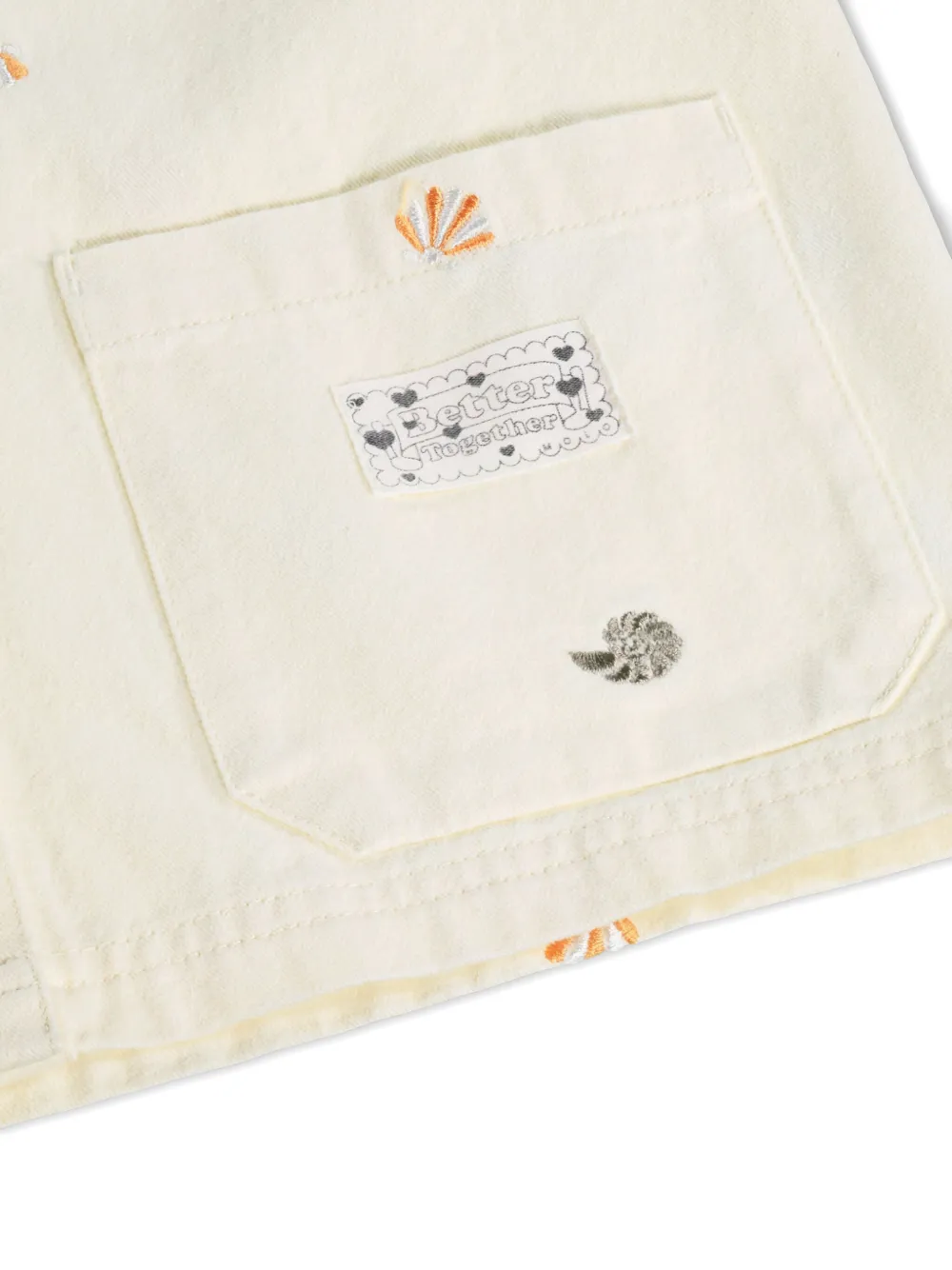 Molo Jack met geborduurde schelpen Beige