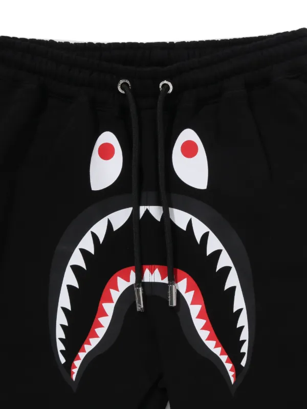 A BATHING APE® シャークヘッド トラックパンツ | ブラック | FARFETCH JP