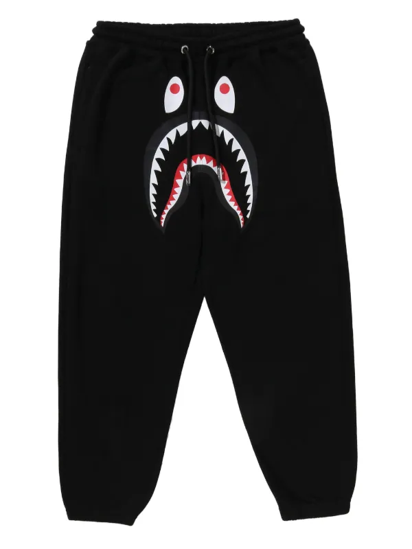 A Bathing Ape シャークパンツ A BATHING APE® シャークヘッド トラックパンツ | ブラック | FARFETCH JP