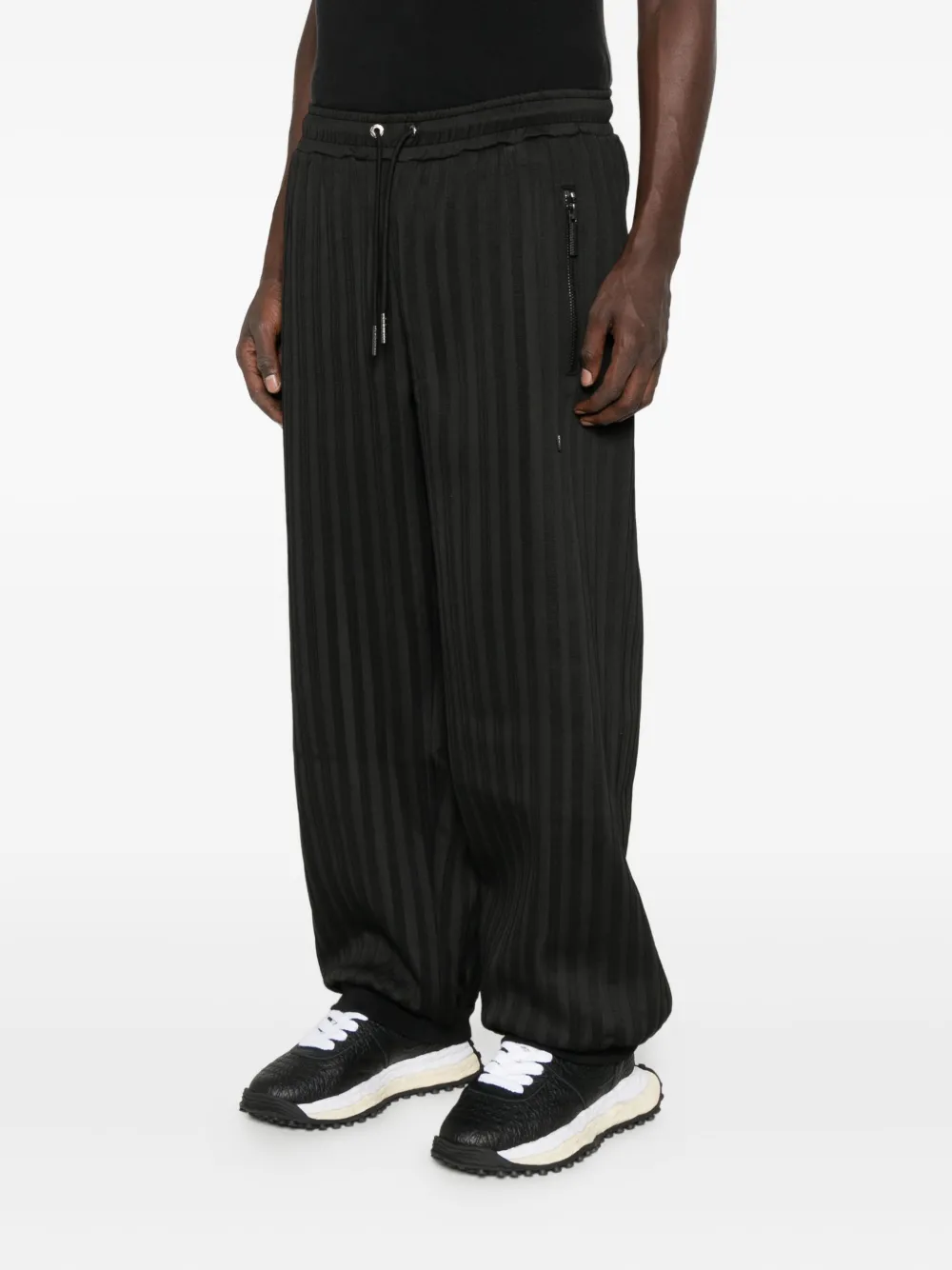 Madfrenzy Striped Zip-pocket Track Pants In Black
