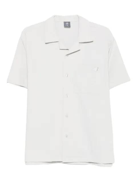 New Balance camisa con bolsillo