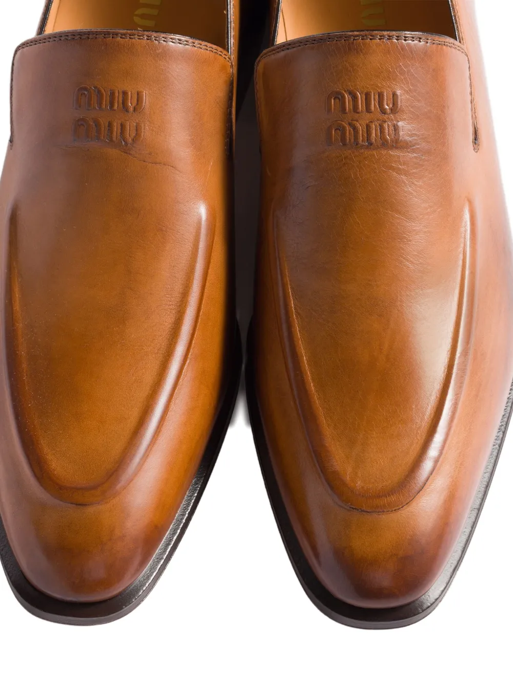 Miu Miu Embossed-logo Loafers In Brown