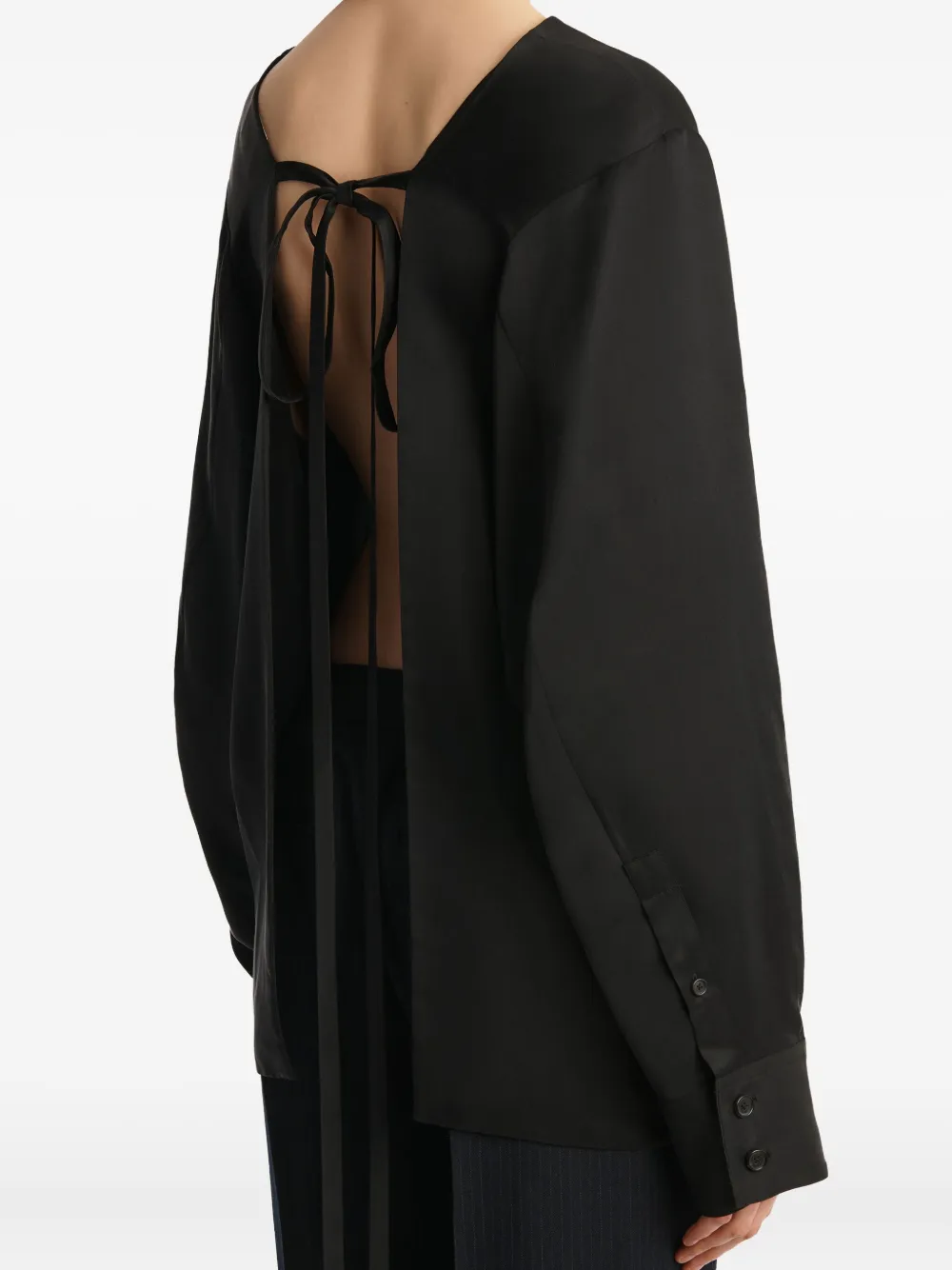 KHAITE Top met gestrikte rug en lange mouwen Zwart